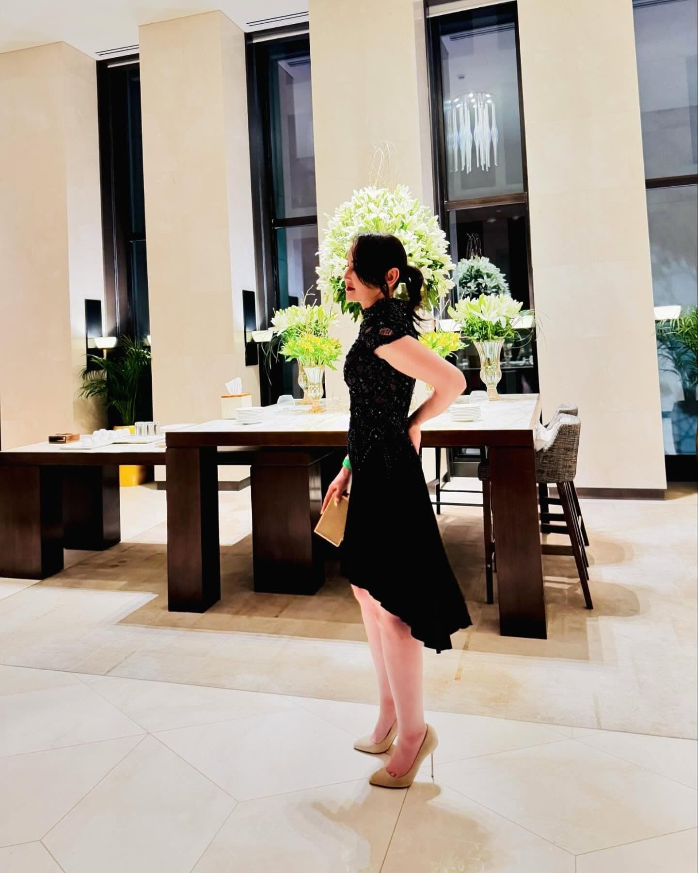 Oko Tilyeukhan in a black lace couture evening dress