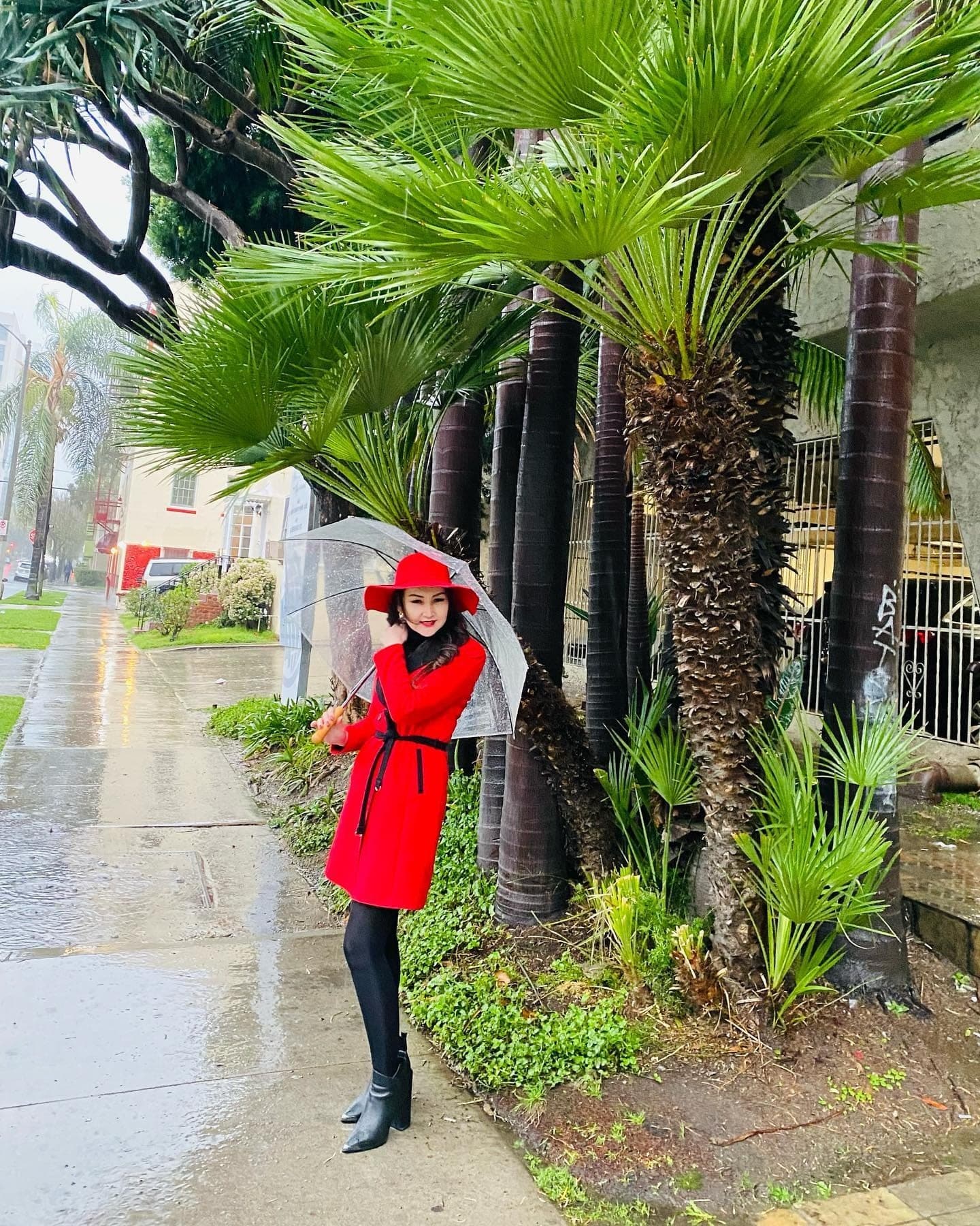 Oko Tilyeukhan in a red coat, street style portrait