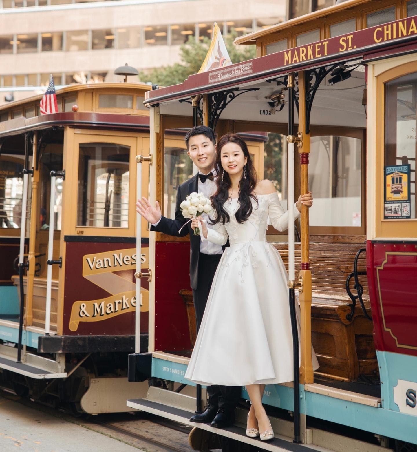 Bride in an OT Haute Couture dress at a San Francisco cable car stop