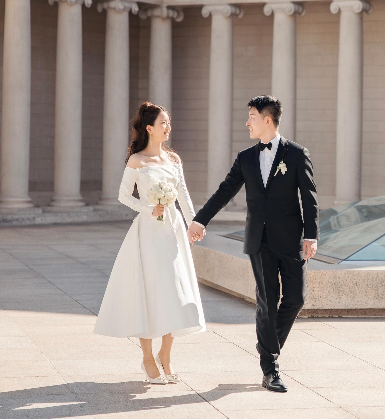Elegant short wedding dress worn at a city celebration with the groom